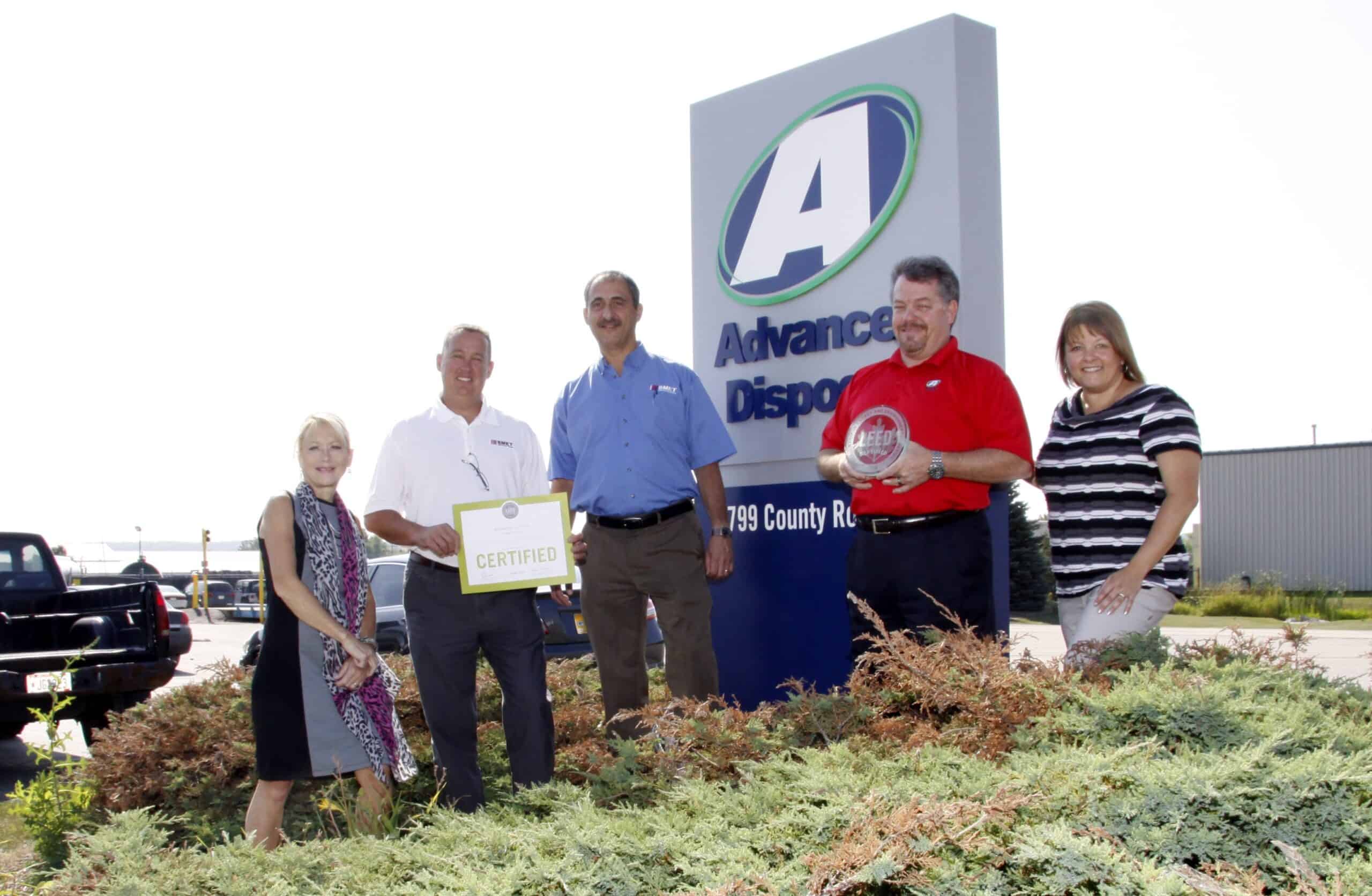 Smet presents Advanced Disposal with LEED award.